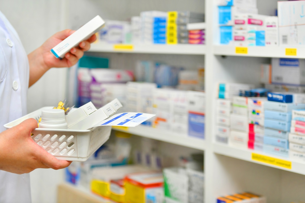 Person looking at medications in a pharmacy