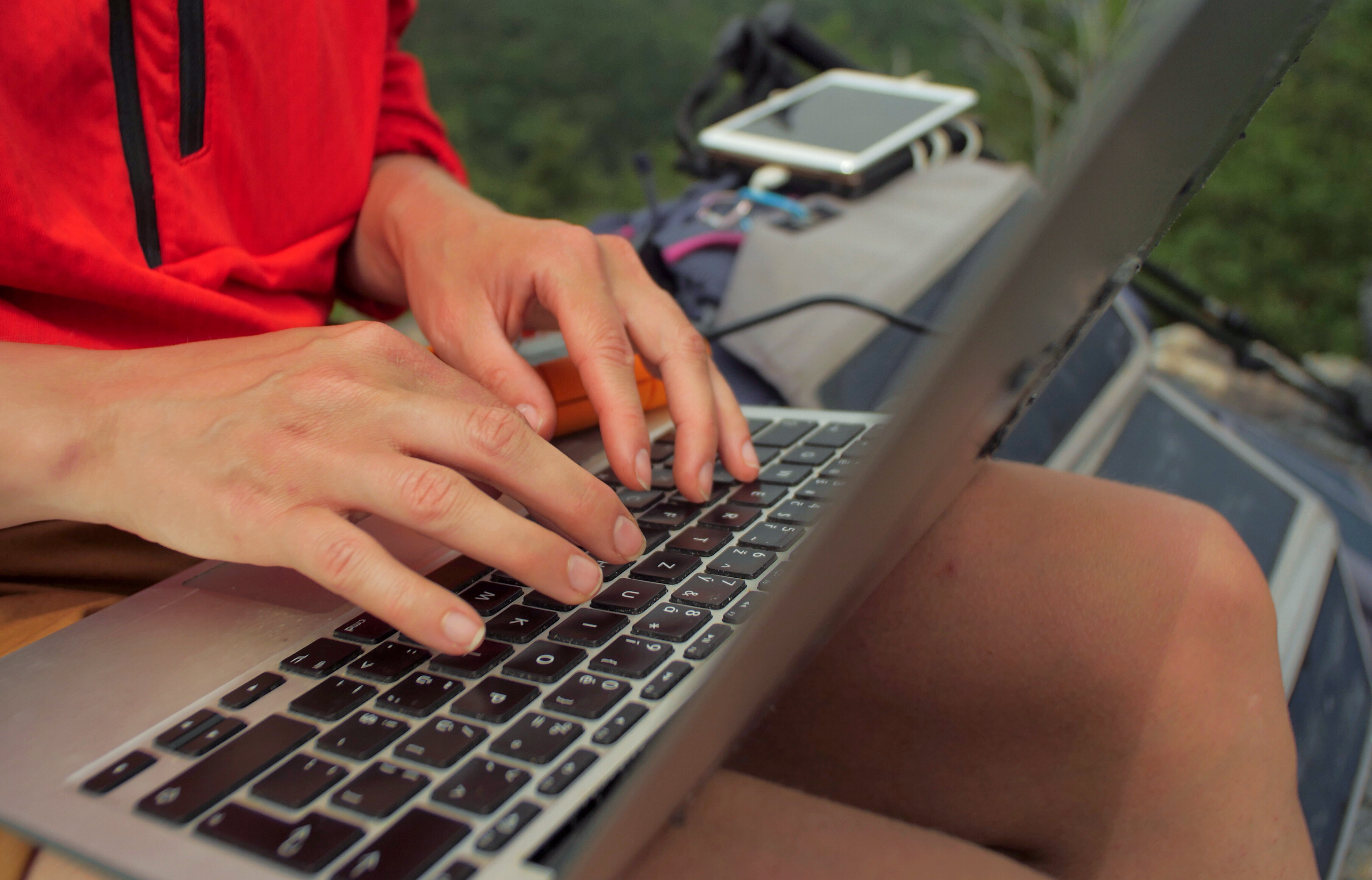 athlete typing on laptop