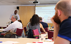 People listening to a conference