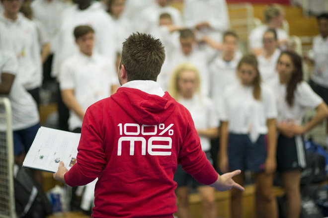 Person wearing red 100% me jumper